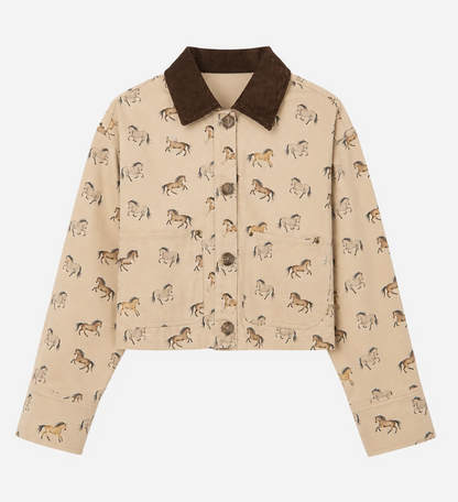 A cropped beige jacket with an allover horse print, featuring a contrasting dark brown corduroy-style collar and brown buttons, shown flat on a light gray background.
