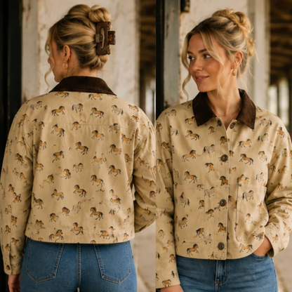 A woman shown from the back and side wearing a beige button-up shirt with an allover horse print and a dark brown collar, paired with blue jeans in an indoor setting.