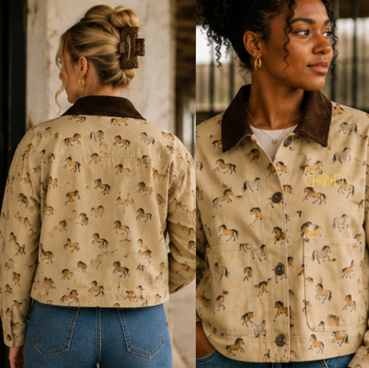 A woman shown from the back and front wearing a cropped beige jacket with an allover horse print, a dark brown corduroy-style collar, and front patch pockets. The jacket has a small gold embroidered monogram on the chest.
