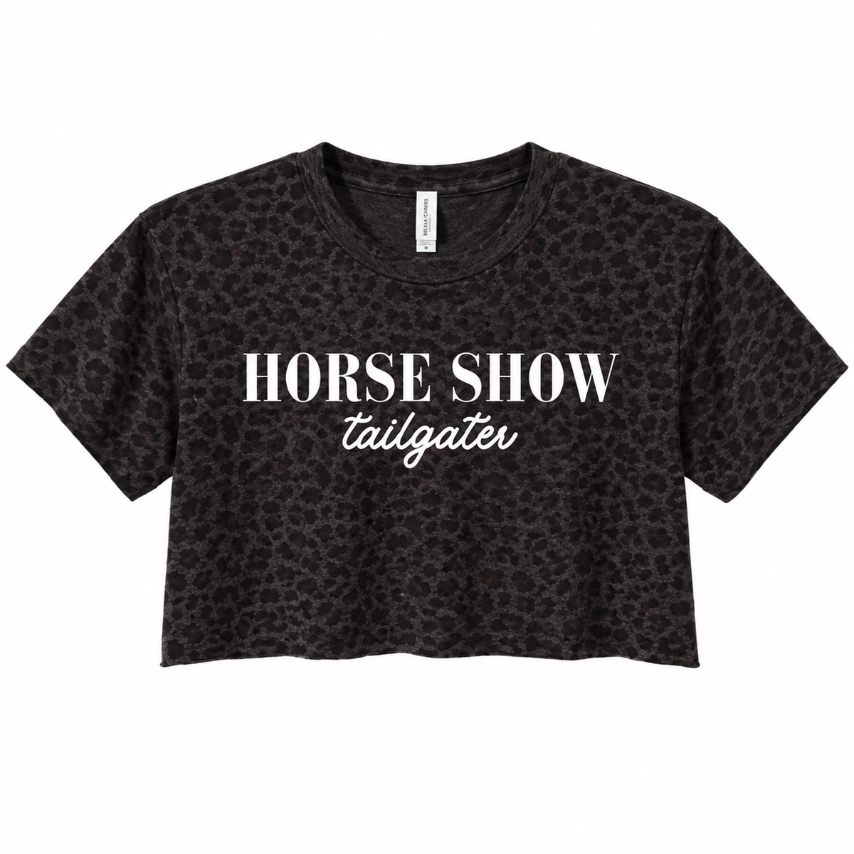 A black cropped t-shirt with a subtle leopard print pattern, featuring the text 'HORSE SHOW' in a bold serif font and 'tailgater' in a white cursive script, displayed on a solid white background.