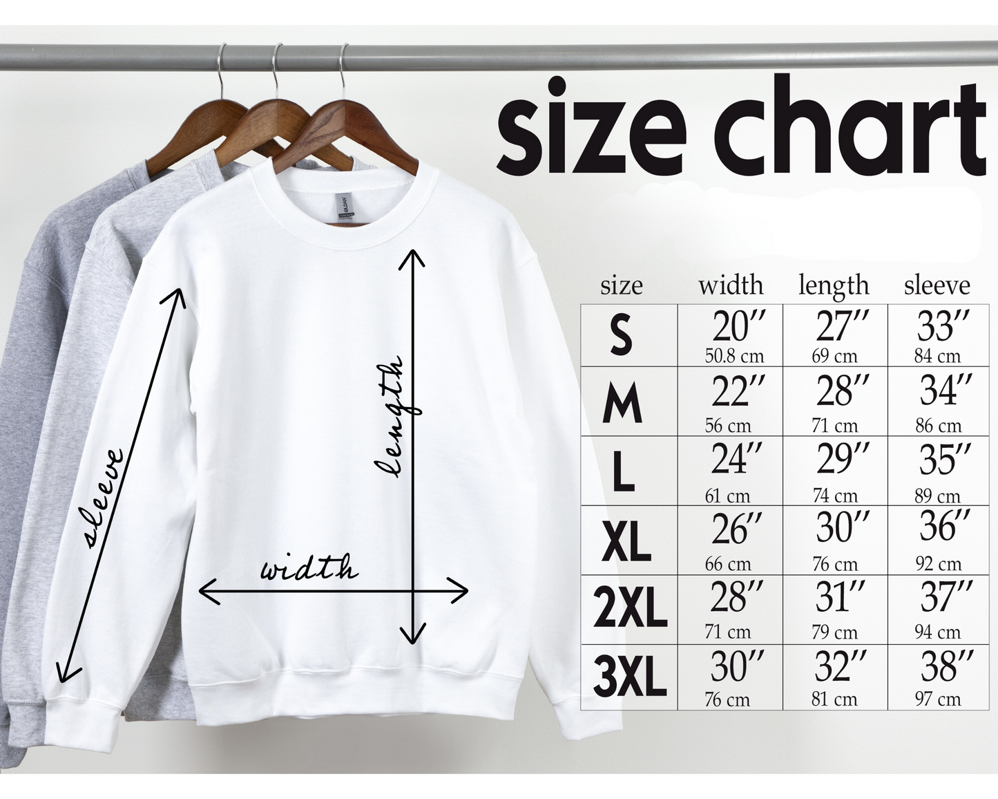 White sweatshirt on a hanger with a size chart displaying measurements.